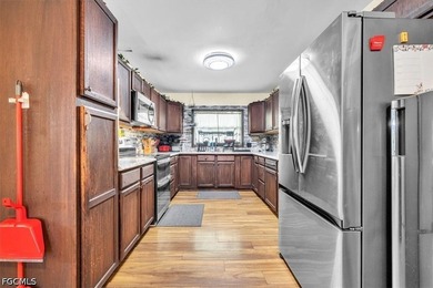 Situated on a spacious 0.65-acre corner lot surrounded by mature - photo 9