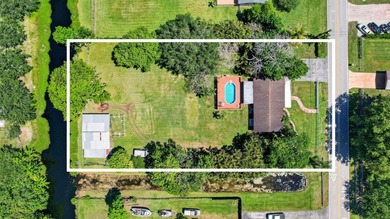 Located in prestigious Southwest Ranches, this beautifully - photo 1
