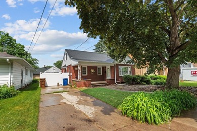 Cozy brick cape cod in excellent location! This home offers - photo 1