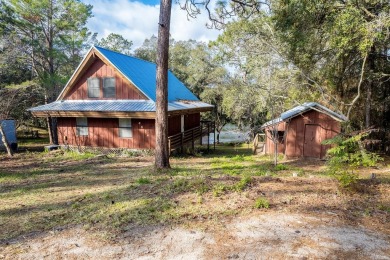 This unique 3-bedroom, 2-bath A-frame home offers a charming - Lake Home For Sale in Keystone Heights, Florida