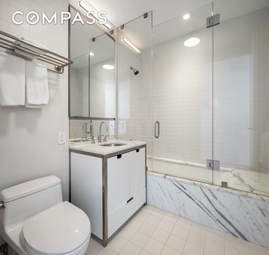 This full-floor, three-bedroom, three-and-a-half-bathroom loft - photo 12
