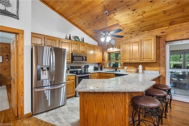 Nestled within the exclusive gated Lake Rhodhiss community of - photo 9