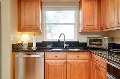 This beautifully updated second-floor unit showcases quality
