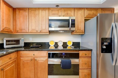 This beautifully updated second-floor unit showcases quality