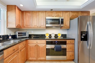 This beautifully updated second-floor unit showcases quality