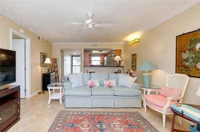 This beautifully updated second-floor unit showcases quality