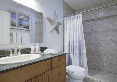 Tucked away just moments from the shoreline, this immaculate - photo 22