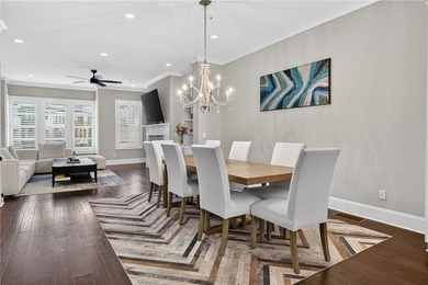 Experience elevated townhome living in the prestigious Gates at