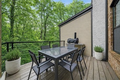 Experience elevated townhome living in the prestigious Gates at