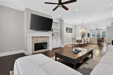 Experience elevated townhome living in the prestigious Gates at