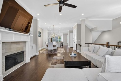 Experience elevated townhome living in the prestigious Gates at