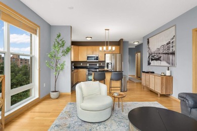 This beautifully updated end-unit condo is filled with natural - photo 1