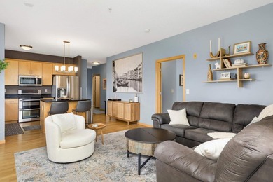 This beautifully updated end-unit condo is filled with natural - photo 2