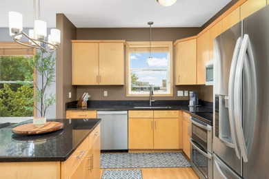 This beautifully updated end-unit condo is filled with natural - photo 7
