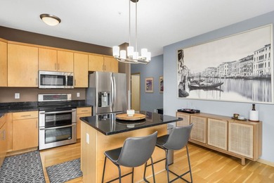 This beautifully updated end-unit condo is filled with natural - photo 9