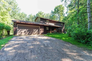 Nestled on two wooded lots just south of Waupaca, this 3BR, 2BA - photo 4
