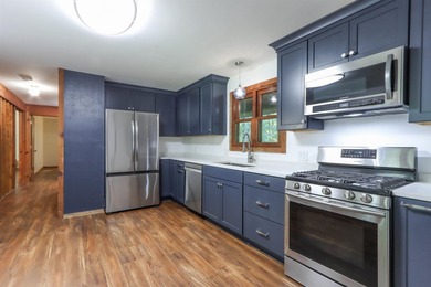 Nestled on two wooded lots just south of Waupaca, this 3BR, 2BA - photo 8