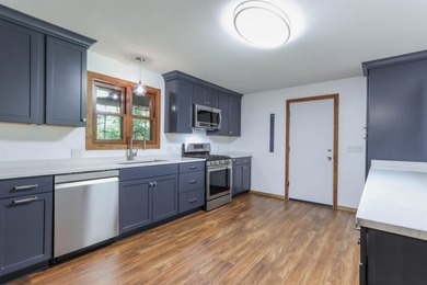 Nestled on two wooded lots just south of Waupaca, this 3BR, 2BA - photo 9