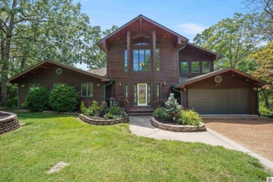 This Fabulous Cedar Chalet on KY Lake is truly a gem. With over - Lake Home For Sale in Benton, Kentucky