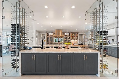 Built for entertaining, the kitchen features stunning mirrored - photo 15