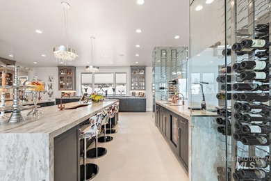 Built for entertaining, the kitchen features stunning mirrored - photo 17
