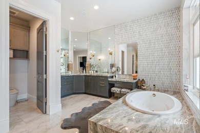Built for entertaining, the kitchen features stunning mirrored - photo 26