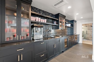 Built for entertaining, the kitchen features stunning mirrored - photo 40