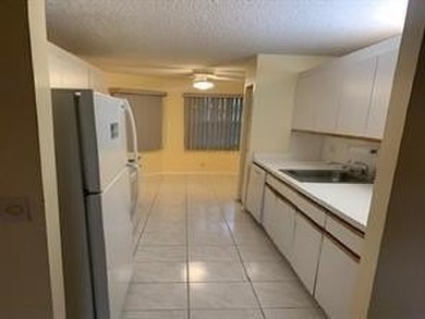 Come see this 2-bedroom, 2-bathroom condo in Century Village - photo 5