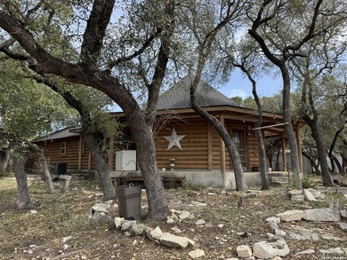 Step into the inviting warmth of this truly unique log cabin - photo 3