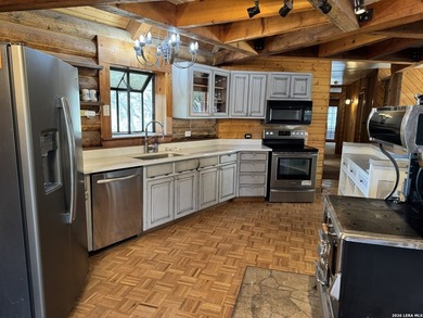 Step into the inviting warmth of this truly unique log cabin - photo 4