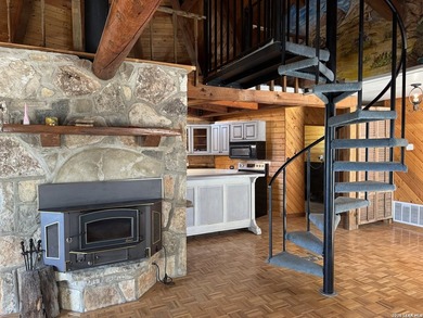 Step into the inviting warmth of this truly unique log cabin - photo 8