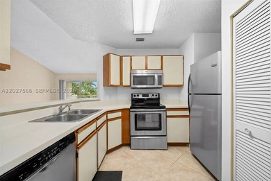 Beautifully updated lakefront condo in a Key West-style gated - photo 1