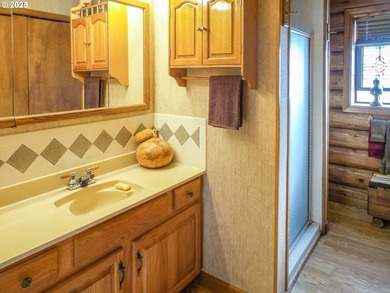 This beautiful log home features soaring ceilings and large - photo 12