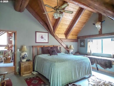 This beautiful log home features soaring ceilings and large - photo 13