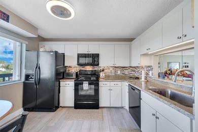 With Lake & Golf views... this corner 3 bdrm, 2 bath condo in - photo 9