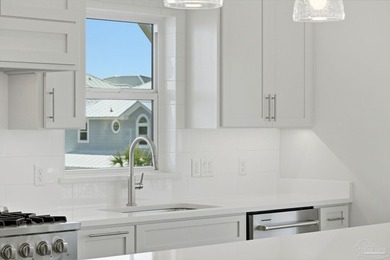 Newly completed in 2026, this stunning corner-lot beach home - photo 11