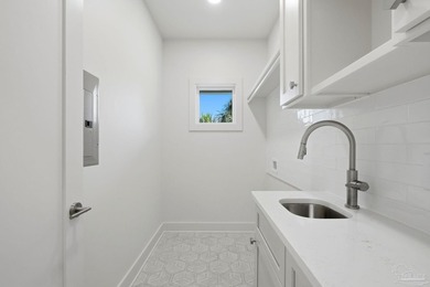 Newly completed in 2026, this stunning corner-lot beach home - photo 31