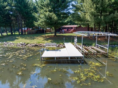 Enjoy 100 feet of owned frontage on Castle Rock Lake with this - photo 8