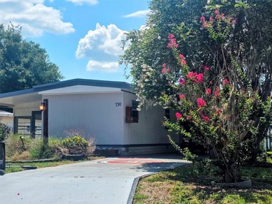 This manufactured home sits on owned land in The Villages. No - photo 3