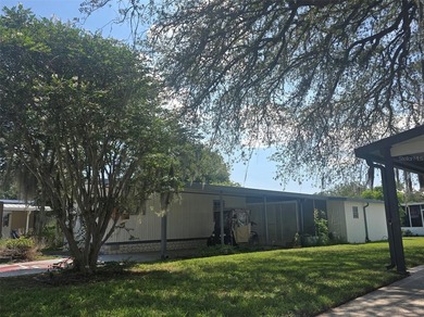 This manufactured home sits on owned land in The Villages. No - photo 4