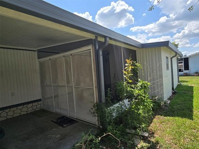 This manufactured home sits on owned land in The Villages. No - photo 7