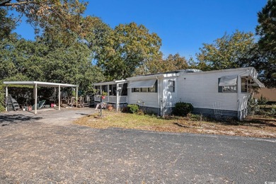 This charming 2-bedroom, 2-bath home in Inlet Oaks Village