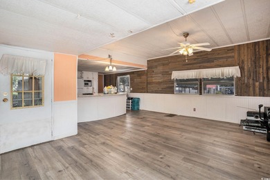 This charming 2-bedroom, 2-bath home in Inlet Oaks Village