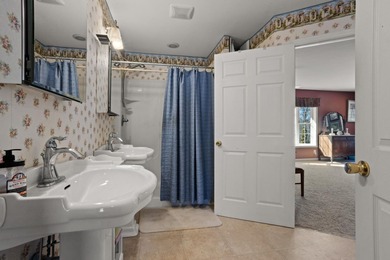 Set on 3.55 waterfront acres, this one-level custom home offers