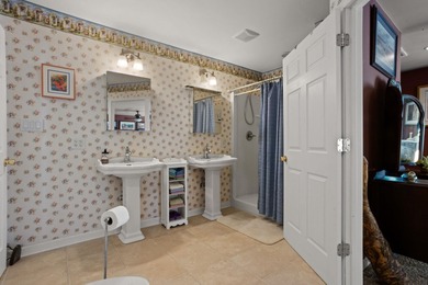 Set on 3.55 waterfront acres, this one-level custom home offers