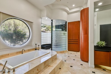 Nestled against a dramatic mountain backdrop and framed by