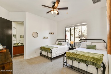 Nestled against a dramatic mountain backdrop and framed by