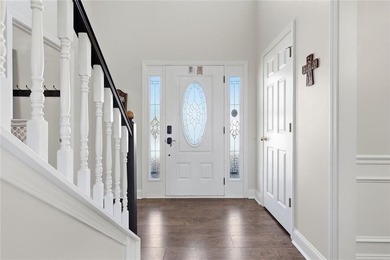 Beautiful brick front 4 bedroom, 4 full bathroom home featuring