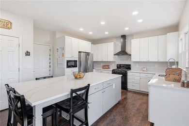 Beautiful brick front 4 bedroom, 4 full bathroom home featuring