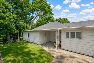 Tucked into a peaceful setting with mature trees and open green - photo 3
